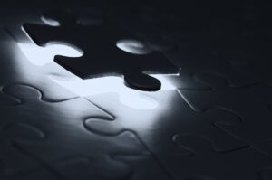Black puzzle piece on white paper photo - Free Problem Image on Unsplash