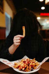 Woman in black and white checkered dress shirt holding brown stick photo - Free Food Image on Unsplash