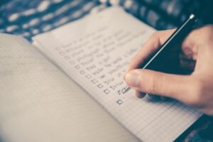 a person writing inside a journal