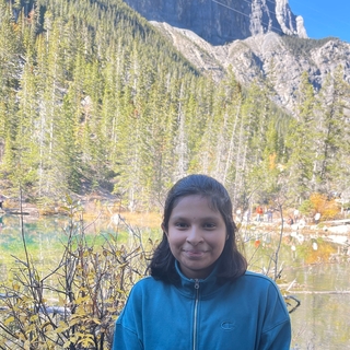 Sukrutha in front of mountain